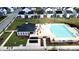 Aerial view of a sparkling community pool and comfortable lounge area surrounded by homes at 1016 Matterhorn Dr, Fuquay Varina, NC 27526