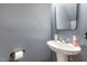 Powder room featuring a pedestal sink with updated fixtures at 103 Coleridge Ct, Carrboro, NC 27510