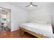 Bedroom with hardwood floors, ceiling fan, and bright window at 103 Coleridge Ct, Carrboro, NC 27510