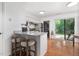 Kitchen area with a bar top and an eat-in dining area with natural light at 103 Coleridge Ct, Carrboro, NC 27510