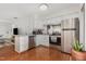 Bright kitchen features granite countertops, stainless appliances, and hardwood floors at 103 Coleridge Ct, Carrboro, NC 27510
