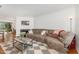 Cozy living room featuring a fireplace, stylish rug, and comfortable reclining sofa at 103 Coleridge Ct, Carrboro, NC 27510