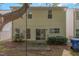 Rear of home features siding and a patio with yard, offering relaxation and space to enjoy nature at 1031 Lake Moraine Pl, Raleigh, NC 27607