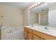 Double vanity bathroom with soaking tub and separate shower at 1031 Lake Moraine Pl, Raleigh, NC 27607
