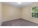 Cozy bedroom with natural light from a single window and neutral carpeting at 1031 Lake Moraine Pl, Raleigh, NC 27607