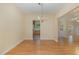Dining room boasts wood floors, neutral paint, and a classic chandelier at 1031 Lake Moraine Pl, Raleigh, NC 27607
