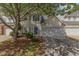 Charming home featuring blue shutters, a well-kept lawn, and an attached two-car garage at 1031 Lake Moraine Pl, Raleigh, NC 27607