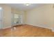 Bright living room featuring hardwood flooring, bay windows and fresh paint at 1031 Lake Moraine Pl, Raleigh, NC 27607