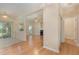 Bright living room with fireplace, ceiling fan and wood floors at 1031 Lake Moraine Pl, Raleigh, NC 27607