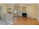 Inviting living room features a fireplace, wood flooring and bright natural light at 1031 Lake Moraine Pl, Raleigh, NC 27607
