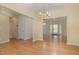 Open-concept living room and dining area with wood floors and neutral colors at 1031 Lake Moraine Pl, Raleigh, NC 27607