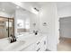 Bright bathroom with dual vanities, sleek fixtures, and a walk-in shower at 104 W Fountainhead Ln, Garner, NC 27529