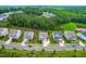 Aerial view of a residential neighborhood with well-maintained homes, green lawns, and tree-lined streets at 113 Hidden Bluff Dr, Chapel Hill, NC 27517