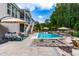 Inviting backyard featuring pool, lounging area, and manicured landscaping at 113 Hidden Bluff Dr, Chapel Hill, NC 27517