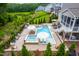 Expansive backyard with a pool, hot tub, and outdoor kitchen, perfect for relaxation and entertaining at 113 Hidden Bluff Dr, Chapel Hill, NC 27517