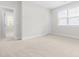 Bedroom with neutral carpeting, modern windows, and bright natural light at 113 Hidden Bluff Dr, Chapel Hill, NC 27517