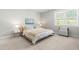 Relaxing bedroom with large window, carpet, and light color walls at 113 Hidden Bluff Dr, Chapel Hill, NC 27517