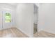 Bright entryway with a wooden floor, a glass panel door, and a view into another room at 113 Hidden Bluff Dr, Chapel Hill, NC 27517