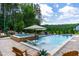 Relaxing pool features a spa, tanning ledge, and adirondack chairs providing a great outdoor experience at 113 Hidden Bluff Dr, Chapel Hill, NC 27517