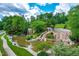 Scenic cascading water feature with lush landscaping and natural stone details, adding serenity to the community at 113 Hidden Bluff Dr, Chapel Hill, NC 27517