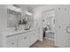 Elegant bathroom features marble countertops, double sinks, and modern fixtures adjacent to bedroom at 11817 Coachmans Way, Raleigh, NC 27614