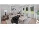 Comfortable bedroom featuring large windows, stylish decor, and plenty of natural light at 11817 Coachmans Way, Raleigh, NC 27614