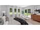 Bedroom showcasing natural light from windows and sliding glass door to outdoor space at 11817 Coachmans Way, Raleigh, NC 27614