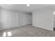 Spacious bedroom featuring neutral paint, carpet, and large closets for ample storage at 11817 Coachmans Way, Raleigh, NC 27614