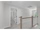 Upstairs hallway features plush carpeting and neutral paint with views to bedrooms at 11817 Coachmans Way, Raleigh, NC 27614