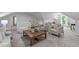 Inviting living room featuring neutral tones, and a modern coffee table centerpiece at 11817 Coachmans Way, Raleigh, NC 27614