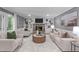 Spacious living room features built-in bookshelves, a fireplace, and neutral-toned furniture at 11817 Coachmans Way, Raleigh, NC 27614