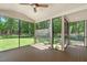 Enclosed sunroom with screened windows providing great views of the lush backyard at 11817 Coachmans Way, Raleigh, NC 27614