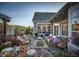 Beautiful backyard oasis featuring an outdoor dining area and manicured landscaping at 1205 Bridgeforth Ln, Chapel Hill, NC 27517