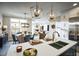 Bright, open-concept kitchen features modern lighting, stainless appliances, and center island at 1205 Bridgeforth Ln, Chapel Hill, NC 27517