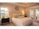 Inviting main bedroom featuring a plush bed, a view and a private door to an outdoor deck at 1205 Bridgeforth Ln, Chapel Hill, NC 27517
