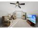 Bonus room with recessed lighting, comfortable seating, tv and plantation shutters at 12505 Garden Tree Ln, Raleigh, NC 27614