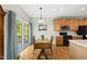 The well-lit kitchen features wooden cabinetry, appliances, and hardwood floors at 12505 Garden Tree Ln, Raleigh, NC 27614