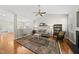 Comfortable living room with hardwood floors, vaulted ceiling, and a view into the dining area at 12505 Garden Tree Ln, Raleigh, NC 27614