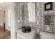 Stylish powder room features unique framed wallpaper, modern fixtures, and elegant black bowl sink at 129 Ruskin Dr, Chapel Hill, NC 27516
