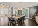 Elegant dining room with hardwood floors, a large chandelier, and view to living room at 129 Ruskin Dr, Chapel Hill, NC 27516