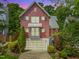 Charming home with a well-manicured lawn, mature trees, and a convenient garage at 129 Ruskin Dr, Chapel Hill, NC 27516