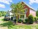 Exterior view of a beautiful home with manicured landscaping, mature trees, and a well-kept lawn at 129 Ruskin Dr, Chapel Hill, NC 27516
