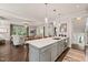 Bright kitchen with a large island, stainless steel appliances, and an open concept design at 129 Ruskin Dr, Chapel Hill, NC 27516