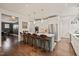 Modern kitchen with a large island, stainless steel appliances, and bar stool seating at 129 Ruskin Dr, Chapel Hill, NC 27516
