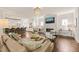 Bright, open living space with fireplace, hardwood floors, and seamless access to the modern kitchen at 129 Ruskin Dr, Chapel Hill, NC 27516