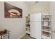 Pantry room featuring a fridge, shelving, and storage for lunch boxes at 129 Ruskin Dr, Chapel Hill, NC 27516