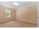 Simple bedroom with neutral walls, carpet, and a large window at 130 S Creek Dr, Louisburg, NC 27549