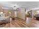 Open-concept living room with wood-look floors and a view of the kitchen and dining area at 130 S Creek Dr, Louisburg, NC 27549