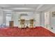 Entertaining basement space with a charming bar area featuring wooden bar stools and unique detailing at 1325 Red Brick Rd, Garner, NC 27529
