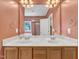 Bathroom with a double sink vanity, wooden cabinets, and a large mirror, offering a functional space at 1325 Red Brick Rd, Garner, NC 27529